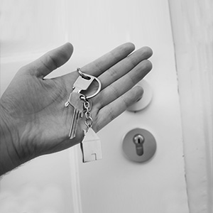 hand with keys to front door